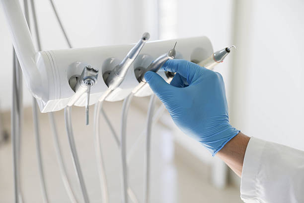 Professional Tooth Extraction technician working in West Bend, WI